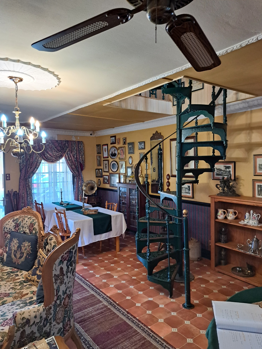 Victorian spiral staircase and period decor inside the guesthouse