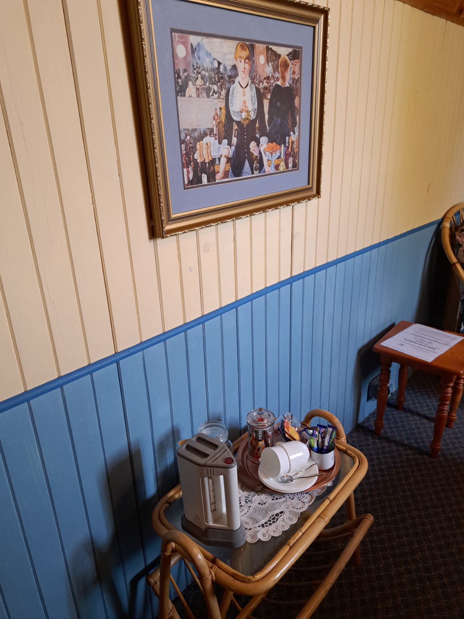 Twin Room — tea station with kettle and framed artwork
